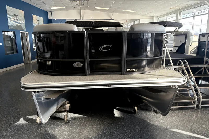 The Image of 2025 Crest 22 SLC Classic LX pontoon boat displayed in showroom. - 1