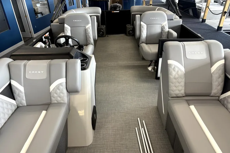 Slide: The Image of 2025 Crest 22 SLC Classic LX boat interior with luxurious gray seating and modern design. - 4