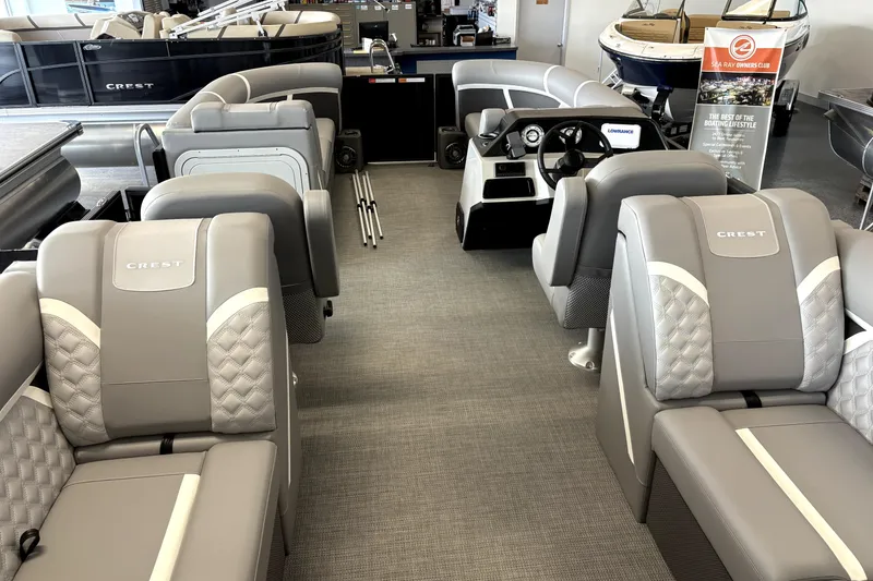 Slide: The Image of 2025 Crest 22 SLC Classic LX pontoon boat interior with luxurious seating and modern dashboard. - 5