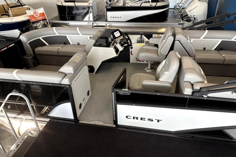 Slide: The Image of 2025 Crest 22 SLC Classic LX pontoon boat interior with plush seating and modern dashboard. - 7