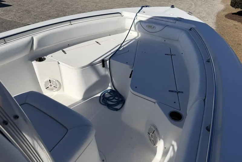 Slide: The Image of 2011 Sea Hunt Triton 225 boat interior with seating and storage compartments. - 10