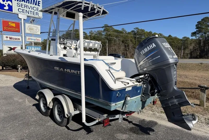 Slide: The Image of 2011 Sea Hunt Triton 225 boat with Yamaha engine on trailer at marine service center. - 6