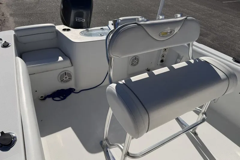Slide: The Image of 2011 Sea Hunt Triton 225 boat interior with seating and Yamaha 150 engine. - 7