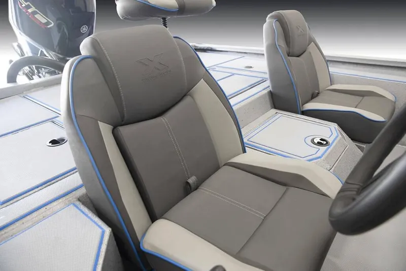 Slide: The Image of 2026 Xpress H20 Bass boat interior with gray and blue seating. - 2