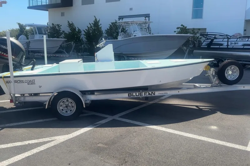The Image of 2025 Custom Mangrove Coast Boats 1700 Harbor Hawk on Bluefin trailer in parking lot. - 0