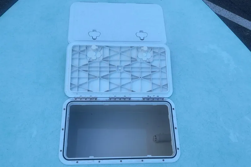 Slide: The Image of Open storage compartment on 2025 Mangrove Coast Boats 1700 Harbor Hawk. - 11