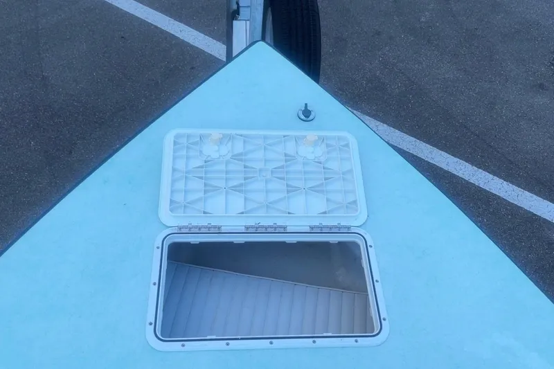 Slide: The Image of Bow of 2025 Mangrove Coast Boats 1700 Harbor Hawk with open hatch on trailer. - 12