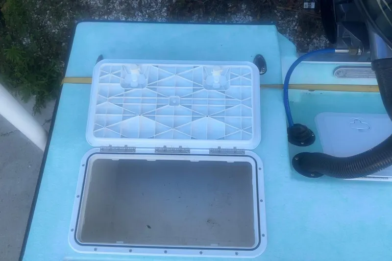 Slide: The Image of Open storage compartment on 2025 Mangrove Coast Boats 1700 Harbor Hawk. - 7