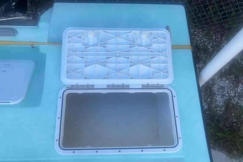 Slide: The Image of Open storage compartment on 2025 Mangrove Coast Boats 1700 Harbor Hawk. - 8