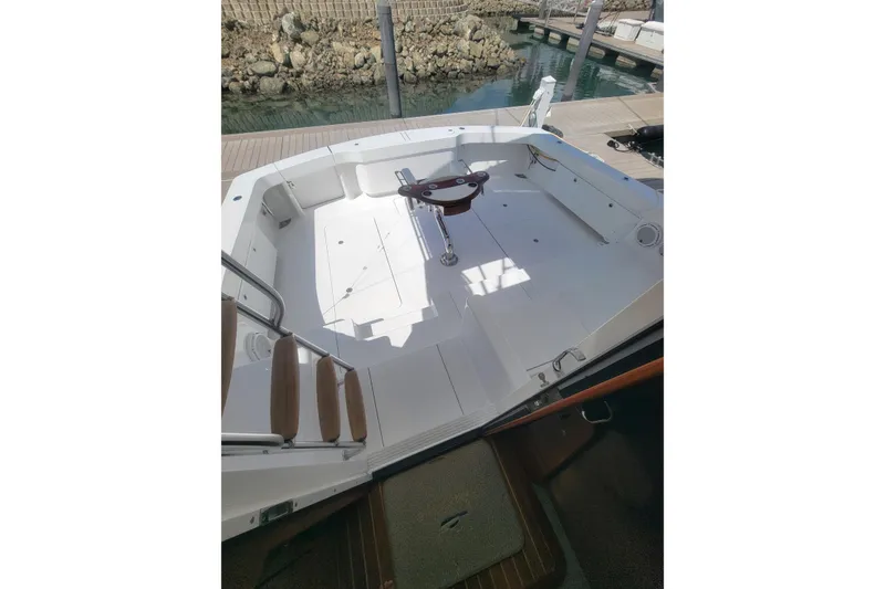 Slide: The Image of 2012 Viking 64c boat cockpit with seating and fishing chair. - 12
