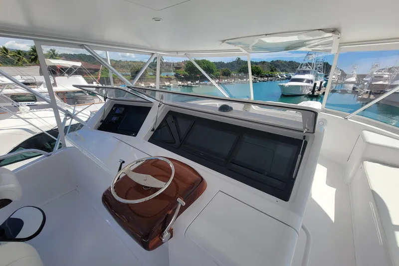 Slide: The Image of Helm of 2012 Viking 64c yacht with marina view. - 16