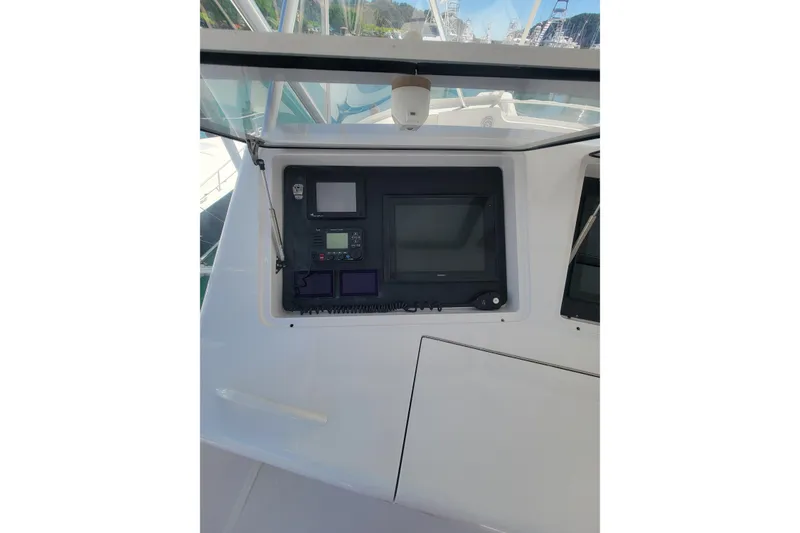 Slide: The Image of Control panel of 2012 Viking 64c yacht with navigation screens and instruments. - 18