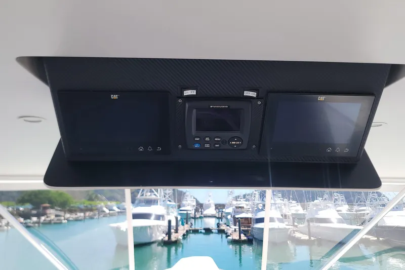 Slide: The Image of Viking 64c 2012 yacht dashboard with navigation screens and marina view. - 21