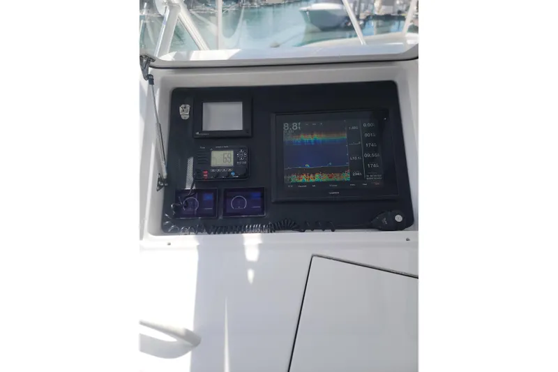 Slide: The Image of Control panel of a 2012 Viking 64c yacht with navigation and communication equipment. - 24