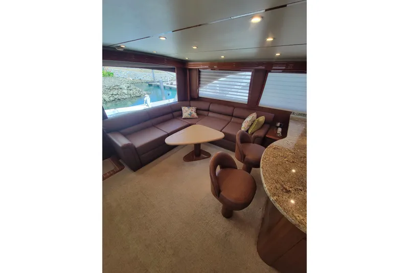 Slide: The Image of Luxurious interior of 2012 Viking 64c yacht with plush seating and elegant decor. - 28