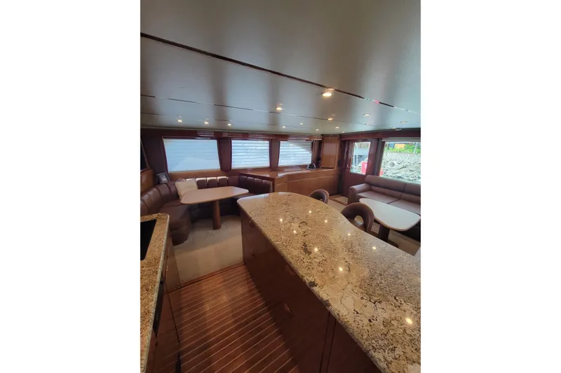 Slide: The Image of Luxurious interior of 2012 Viking 64c yacht with elegant seating and granite countertops. - 31