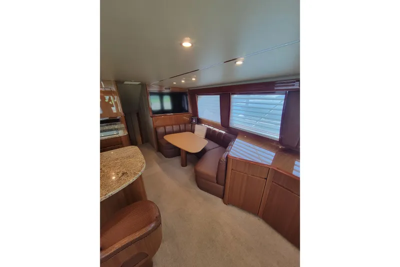 Slide: The Image of Luxurious interior of 2012 Viking 64c yacht with elegant seating and dining area. - 32