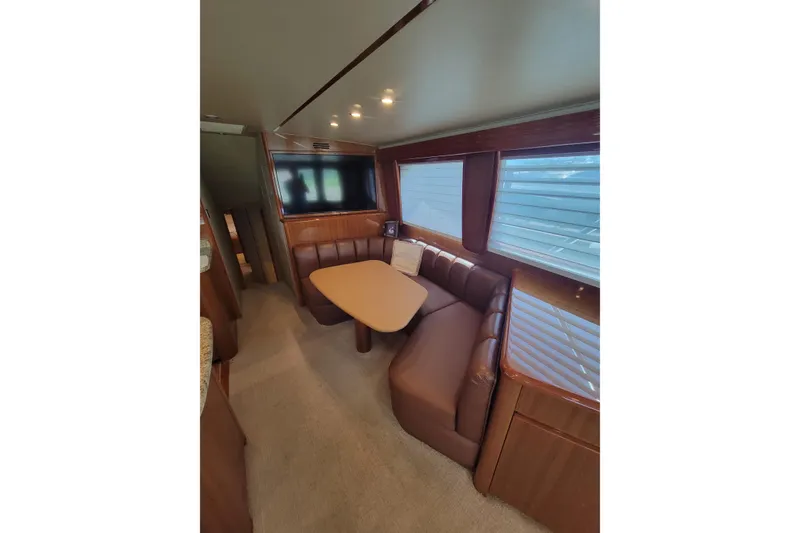 Slide: The Image of Interior of 2012 Viking 64c yacht with dining area and large windows. - 33