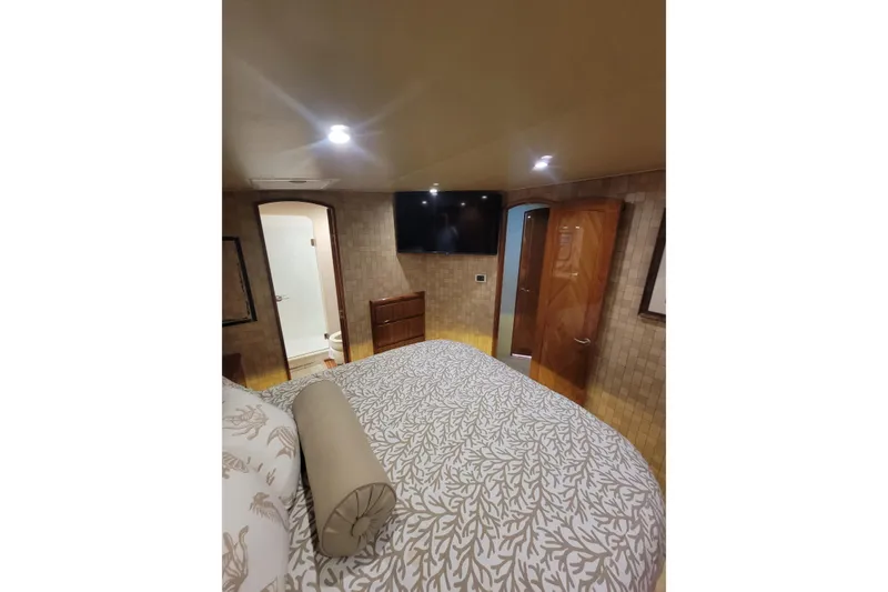 Slide: The Image of Luxurious bedroom interior of 2012 Viking 64c yacht with elegant decor and modern amenities. - 38