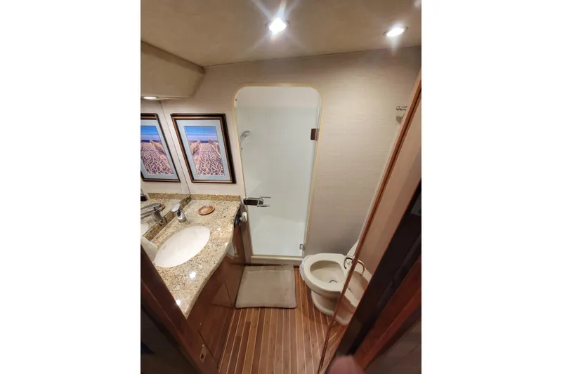 Slide: The Image of Luxurious bathroom in 2012 Viking 64c yacht with granite countertop and shower. - 40