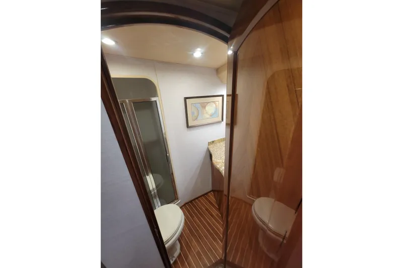 Slide: The Image of Luxurious bathroom interior of 2012 Viking 64c yacht with modern fixtures and wood accents. - 42