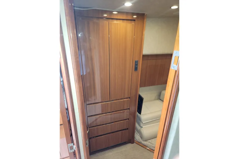 Slide: The Image of Interior of 2012 Viking 64c yacht with wooden cabinetry and seating area. - 45
