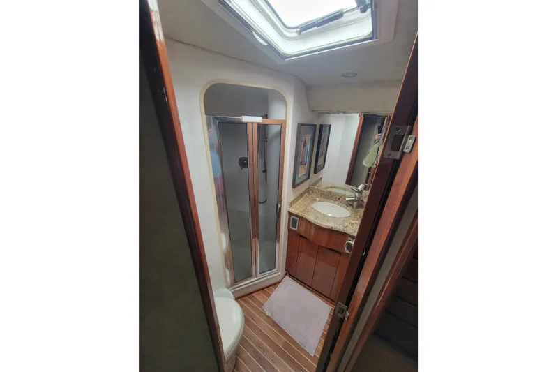 Slide: The Image of Luxurious bathroom in 2012 Viking 64c yacht with skylight and modern amenities. - 47
