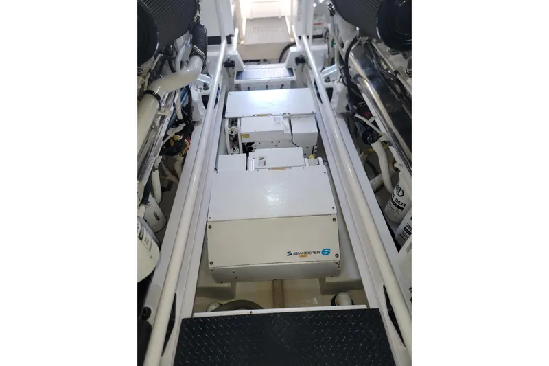 Slide: The Image of Engine room of 2012 Viking 64c yacht featuring Seakeeper 6 stabilizer system. - 50