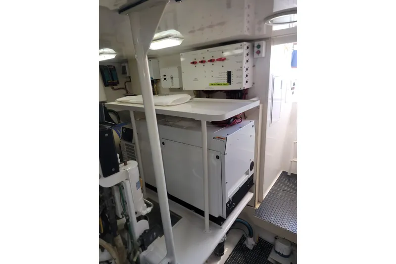 Slide: The Image of Engine room of 2012 Viking 64c yacht with electrical equipment and control panels. - 60