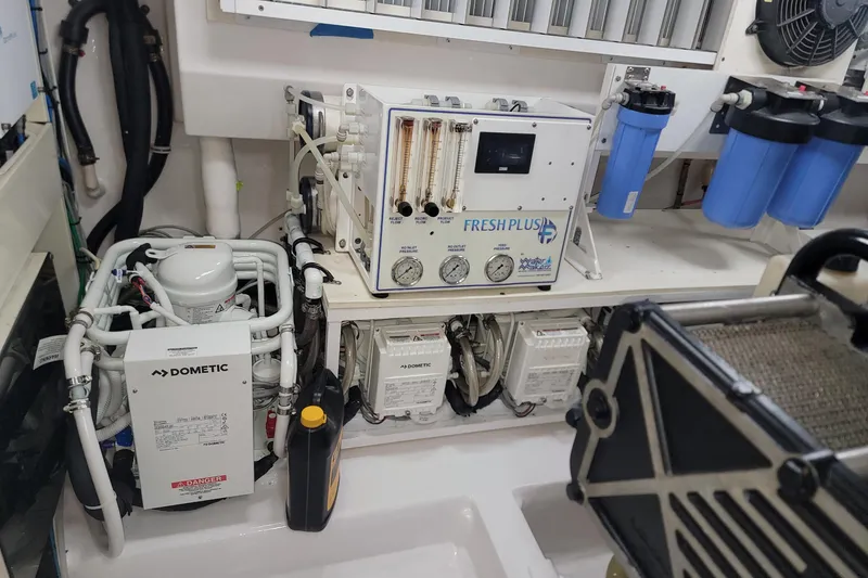 Slide: The Image of Engine room of a 2012 Viking 64c yacht with water filtration system. - 61