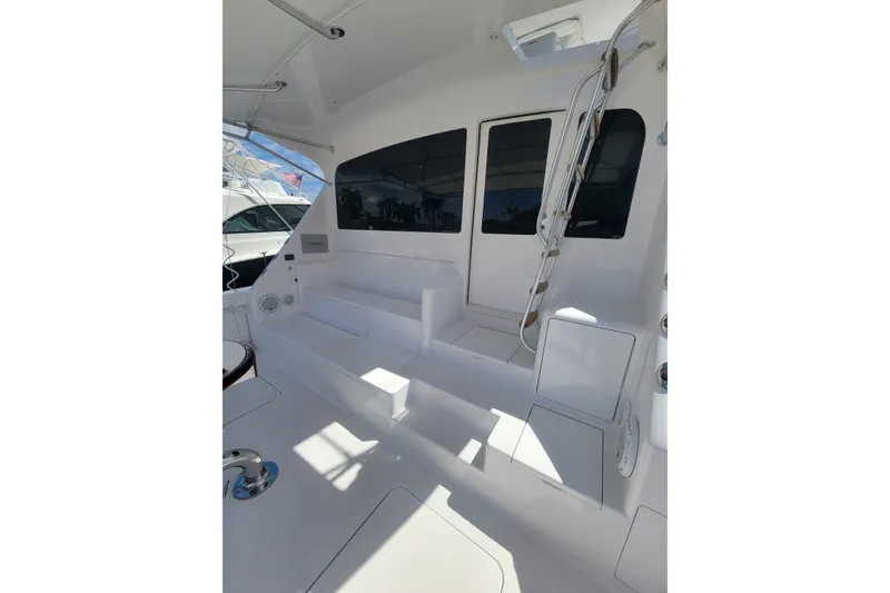Slide: The Image of 2012 Viking 64c yacht cockpit with white seating and sleek design. - 8