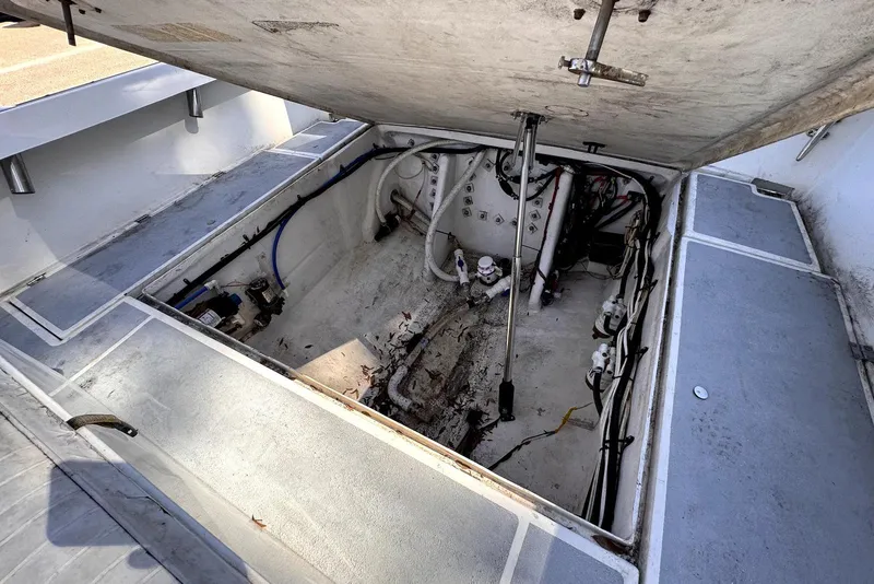 Slide: The Image of 2005 Mirage SF32 Center Console boat interior with open engine compartment. - 17