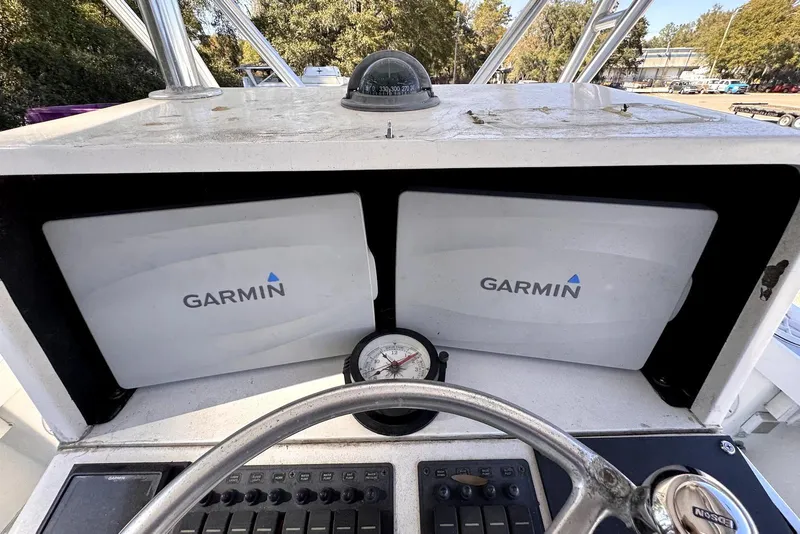 Slide: The Image of 2005 Mirage SF32 Center Console with Garmin navigation displays and compass. - 21