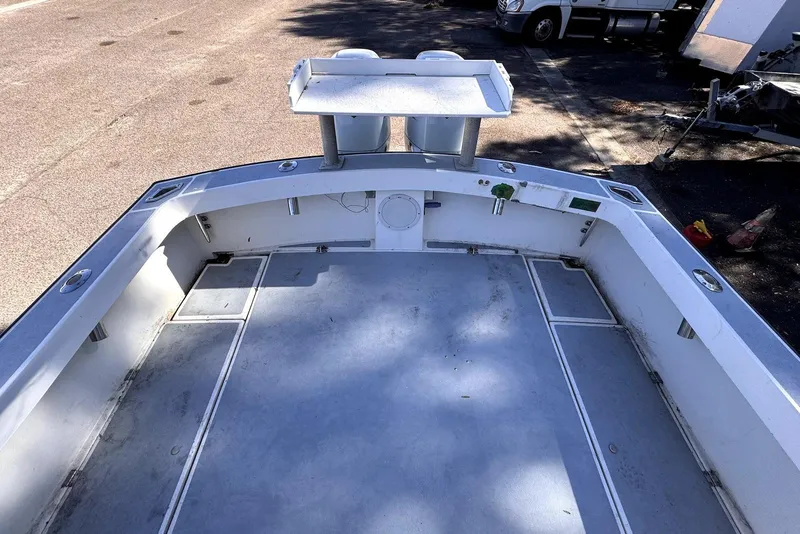 Slide: The Image of 2005 Mirage SF32 Center Console boat interior with spacious deck and storage compartments. - 26