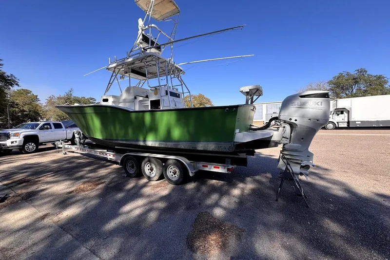 Slide: The Image of 2005 Mirage SF32 Center Console boat on trailer with Suzuki outboard motor. - 3