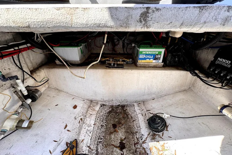 Slide: The Image of 2005 Mirage SF32 Center Console boat interior with batteries and wiring. - 37