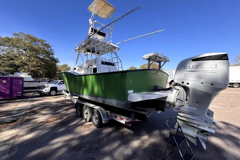 Slide: The Image of 2005 Mirage SF32 Center Console boat on trailer with Suzuki outboard motor. - 6