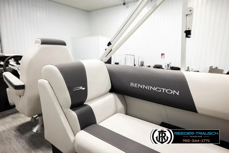 Slide: The Image of 2026 Bennington 22 SSRSF boat interior with branded seating at Reeder-Trausch Marine showroom. - 23