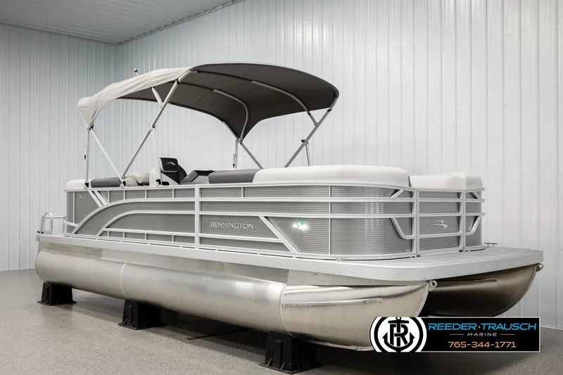 Slide: The Image of 2026 Bennington 22 SSRSF pontoon boat with canopy in showroom. - 3