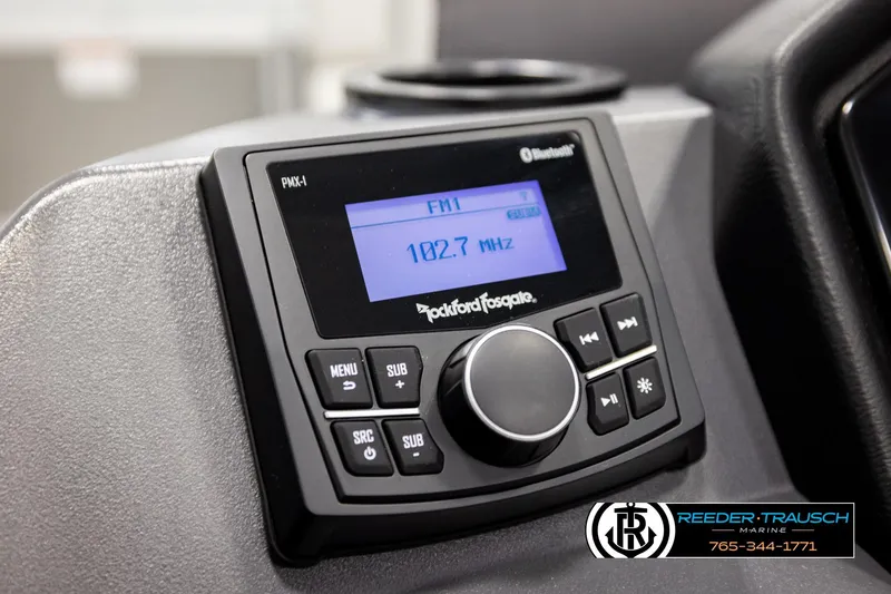 Slide: The Image of 2026 Bennington 22 SSRSF boat stereo system with FM radio display at 102.7 MHz. - 31