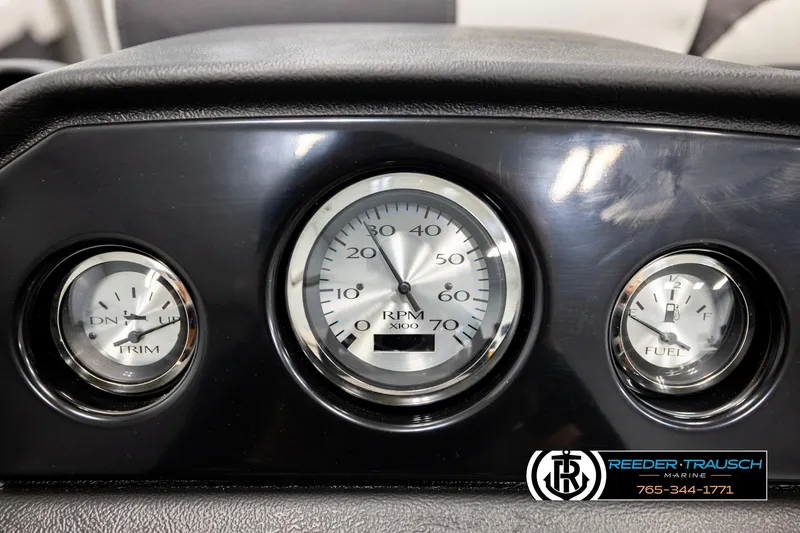 Slide: The Image of Dashboard of 2026 Bennington 22 SSRSF with RPM, trim, and fuel gauges. - 32