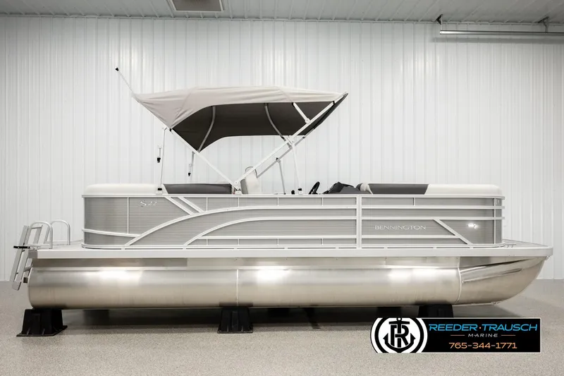 Slide: The Image of 2026 Bennington 22 SSRSF pontoon boat with canopy in showroom. - 5
