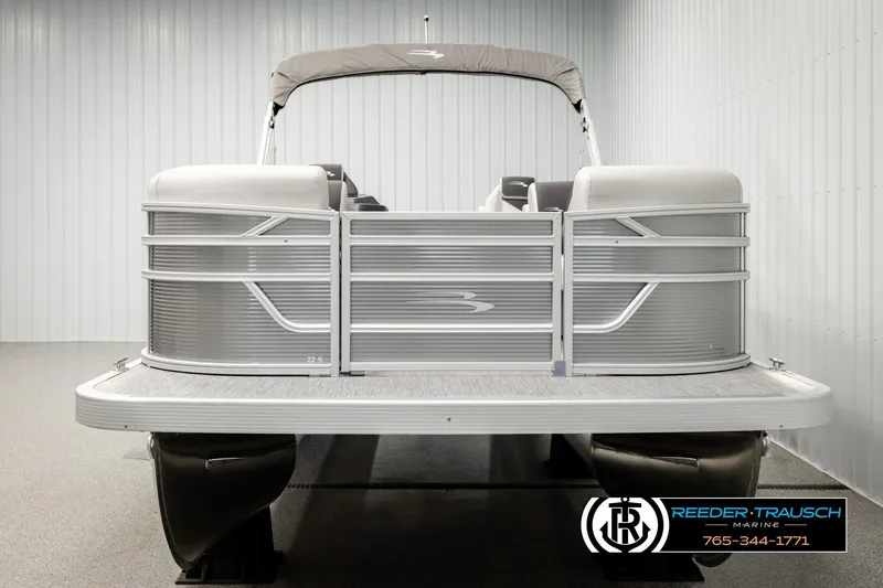Slide: The Image of 2026 Bennington 22 SSRSF pontoon boat in showroom, front view. - 8