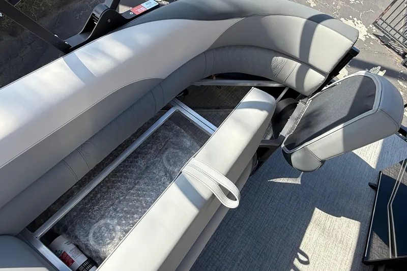 Slide: The Image of 2026 Avalon LSZ 25 Quad Lounge with open storage compartment and sleek seating design. - 13