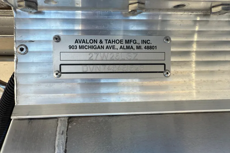 Slide: The Image of Metal identification plate on Avalon LSZ 25 Quad Lounge, 2026 model, by Avalon & Tahoe Mfg. - 14
