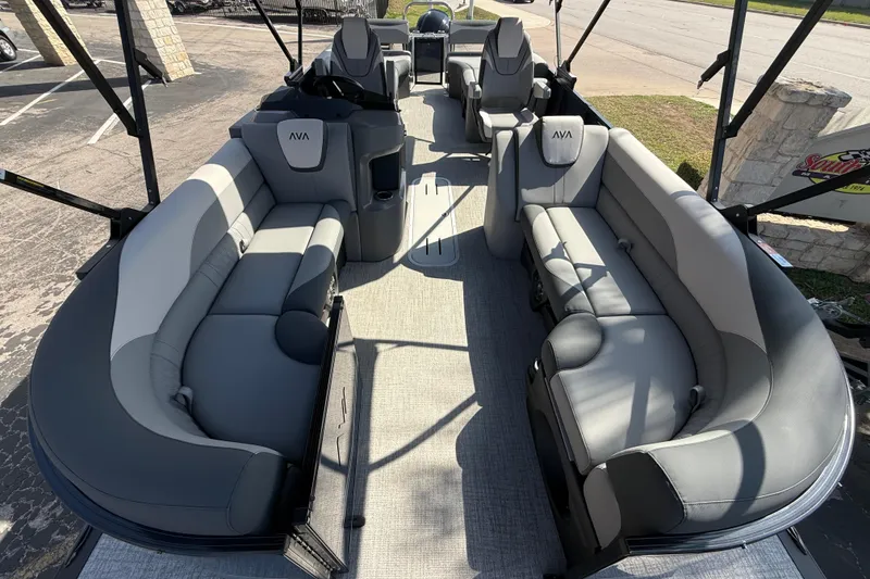 Slide: The Image of 2026 Avalon LSZ 25 Quad Lounge pontoon boat with spacious seating and modern design. - 4