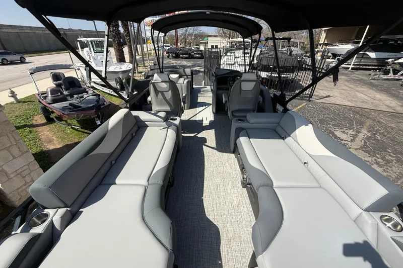 Slide: The Image of 2026 Avalon LSZ 25 Quad Lounge pontoon boat with spacious seating and canopy. - 6