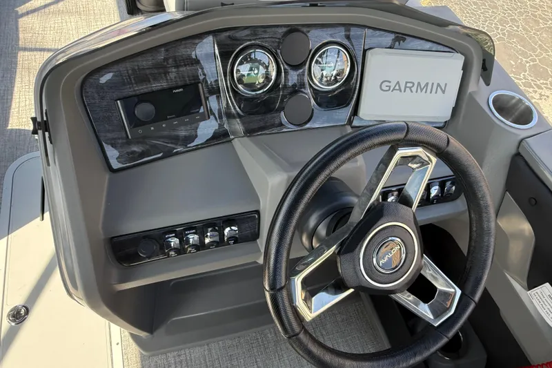 Slide: The Image of 2026 Avalon LSZ 25 Quad Lounge dashboard with Garmin navigation and modern controls. - 9