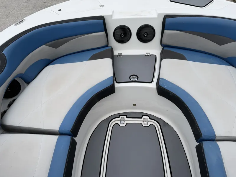 Slide: The Image of Interior of a 2015 Hurricane SS203 CROSSFIR boat with blue and gray seating. - 12