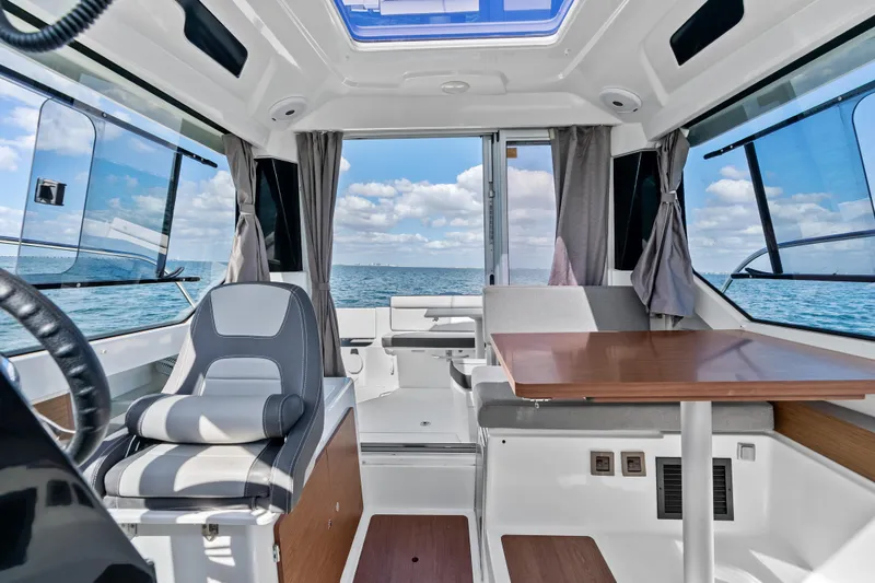 Slide: The Image of Interior of 2019 Jeanneau NC 795 boat with seating and ocean view. - 20